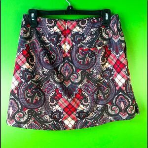 LADY HAGEN sports skirt with burgundy paisley over red plaid print.